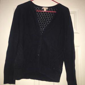 Blue cardigan sweater.